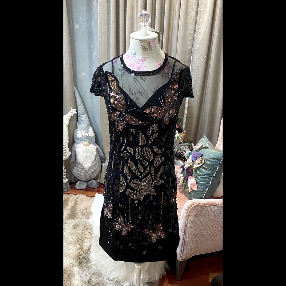 Black cap sleeve dress with beaded detail!